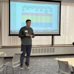 man standing and speaking