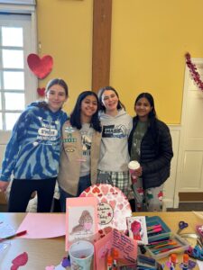 Children in front of Valentines Day Cards